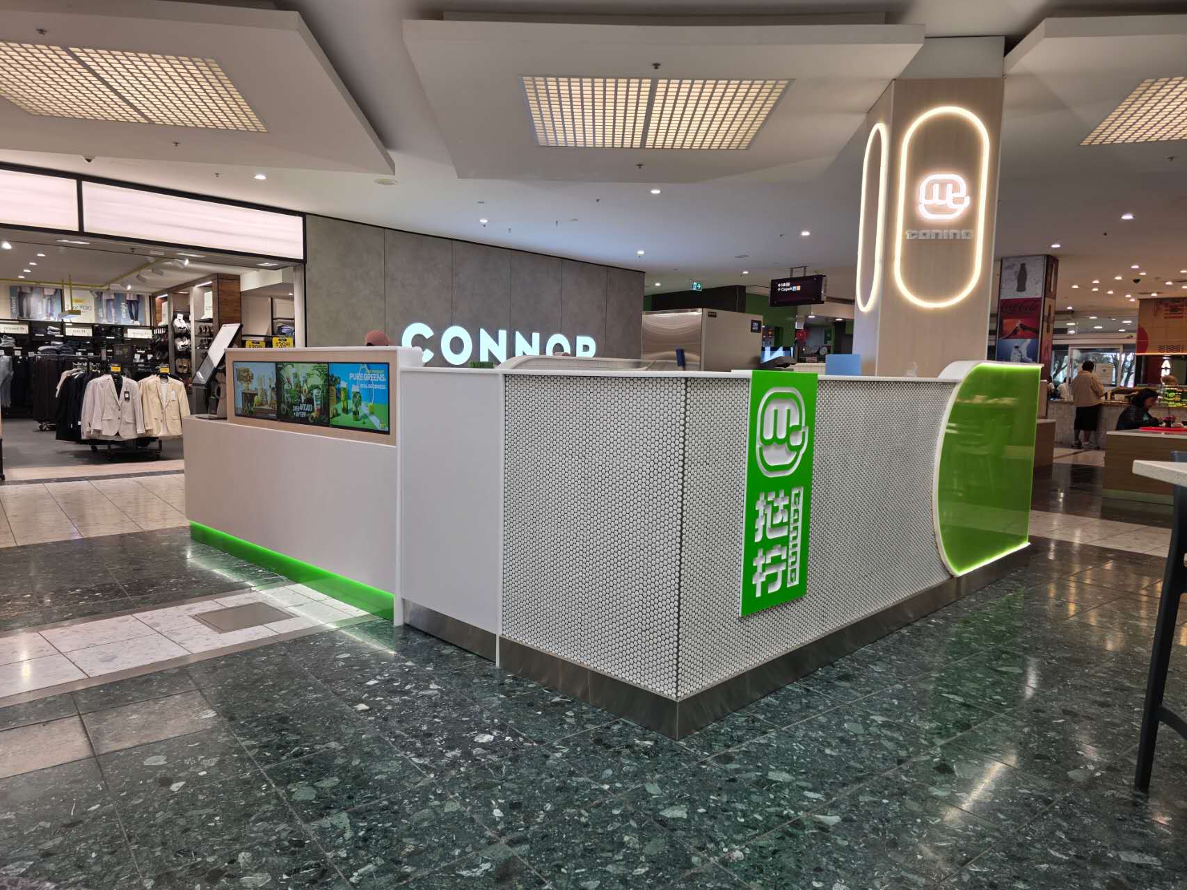 Side view of the completed TANING kiosk