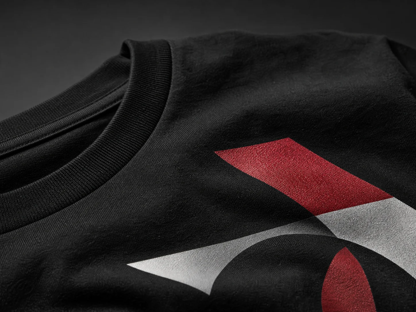 Close-up of a crisp custom print on premium black cotton apparel