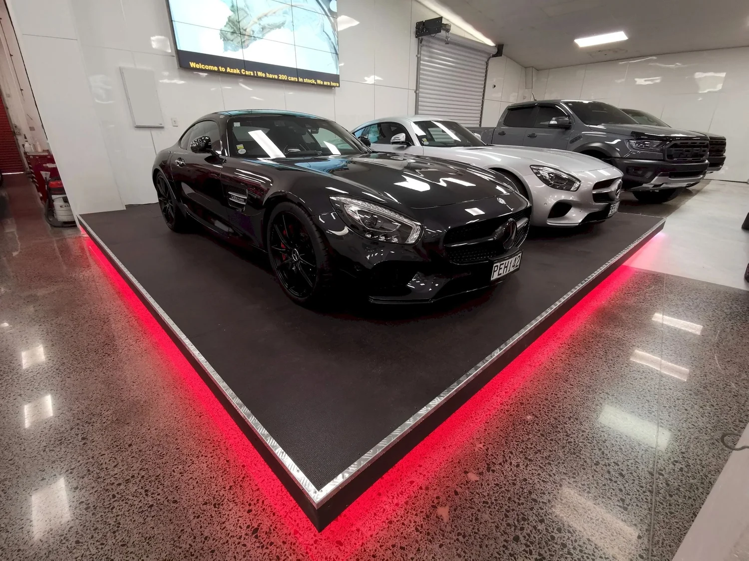 LED-lit vehicle display platform in a completed Auckland showroom renovation